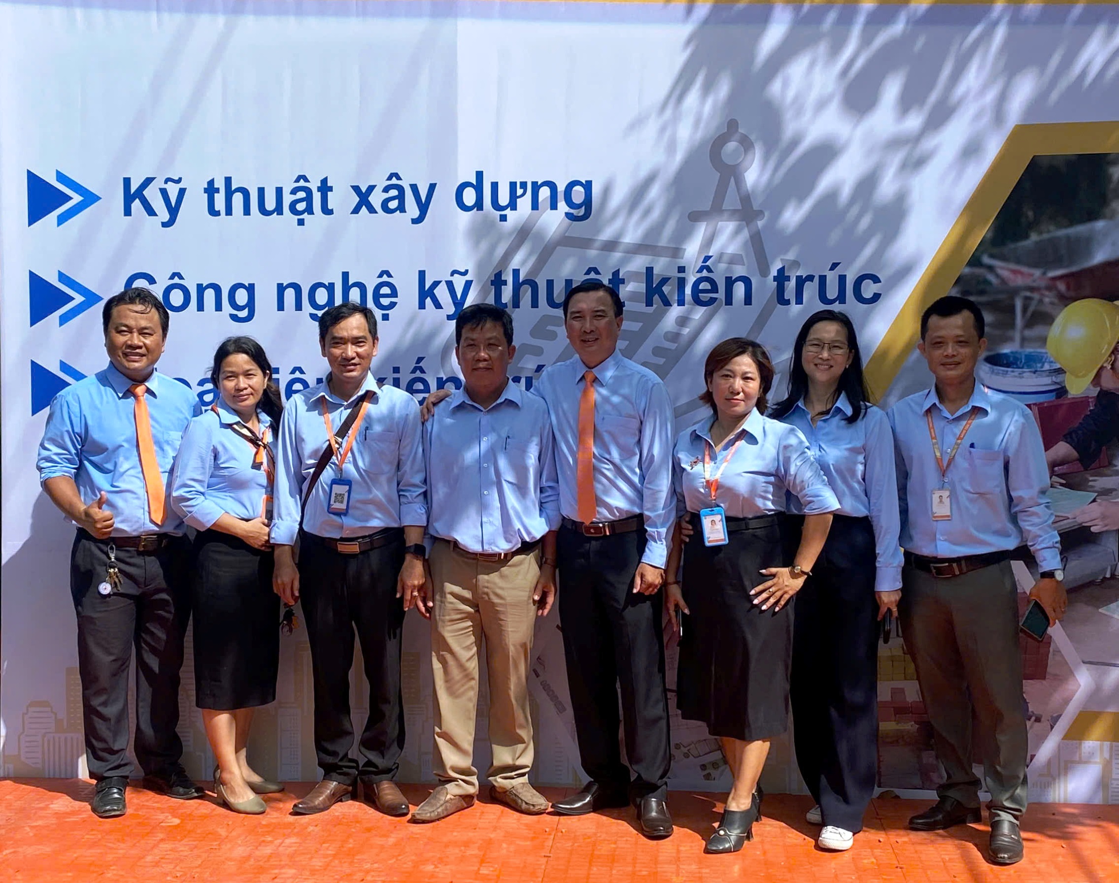 A group of people posing for a photo Description automatically generated